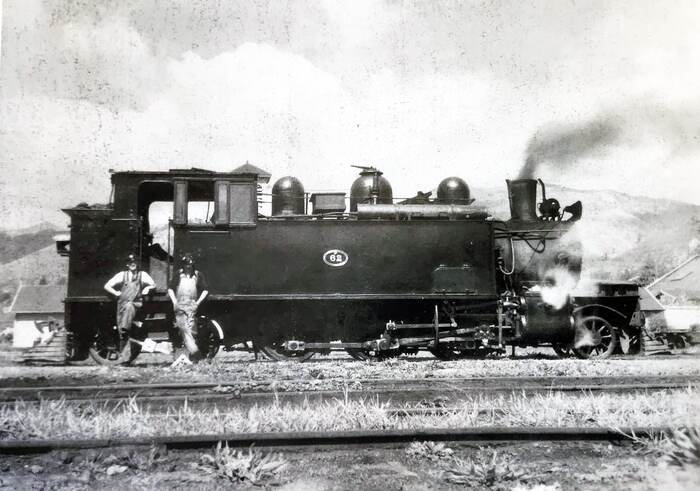 Black and white photo of driver Ces Gledhill and fireman Mr Westrupp with Wf 62 
                            and mixed train, ready for 4.30pm departure, 1944.